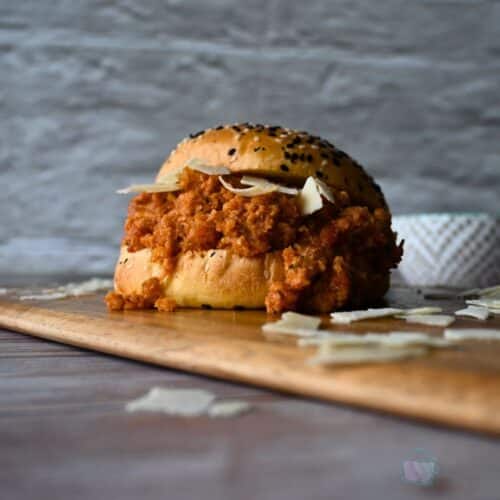 seeded bun filled with slow cooker ground chicken sloppy joes