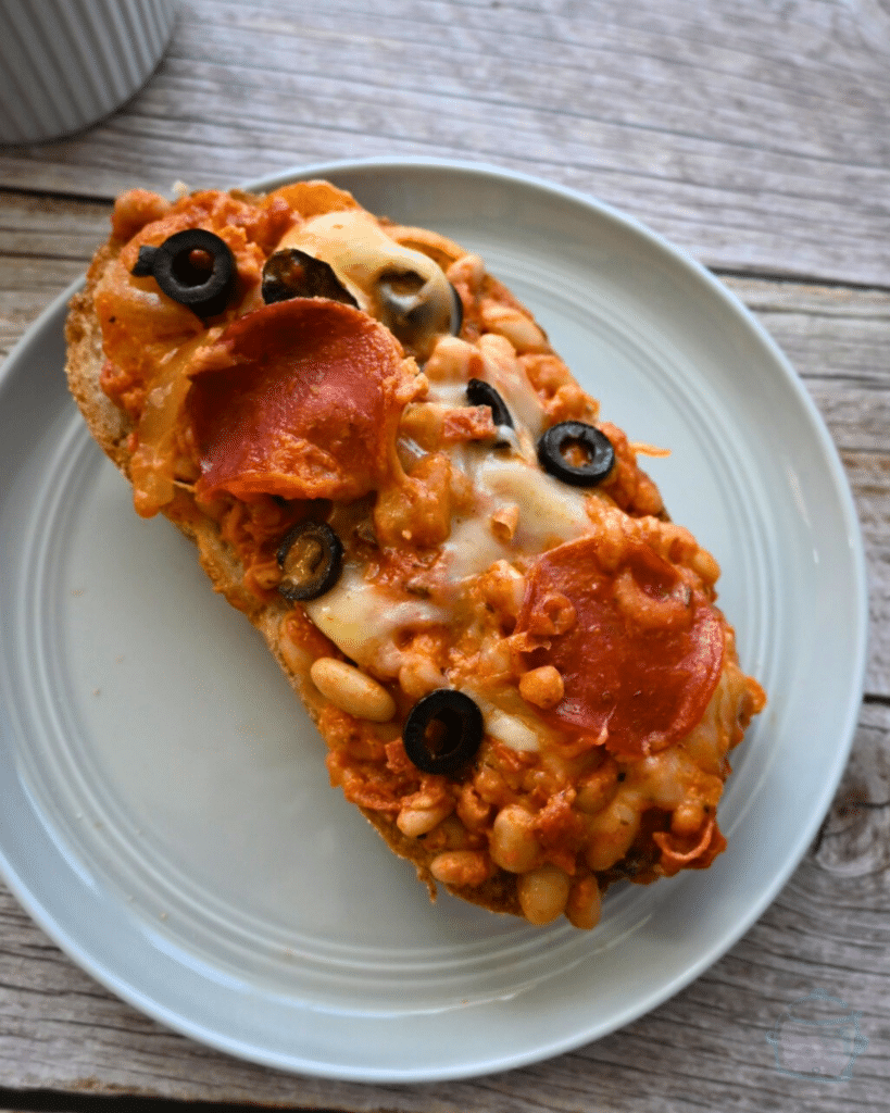 slow cooker pizza bean on a slice of bread