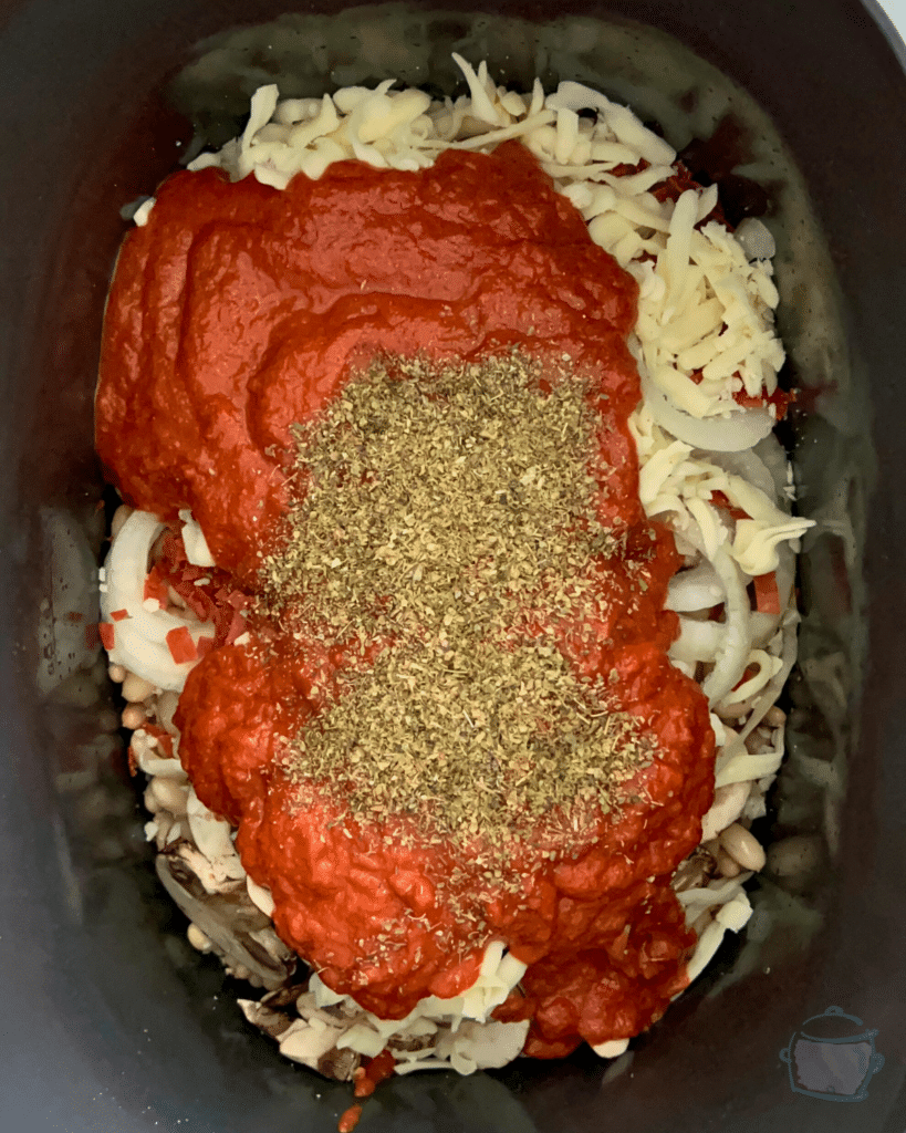 pizza bean ingredients in slow cooker before mixing or cooking