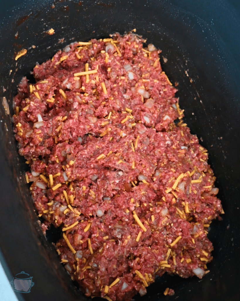 all sloppy joe ingredients in a slow cooker mixed together before cooking