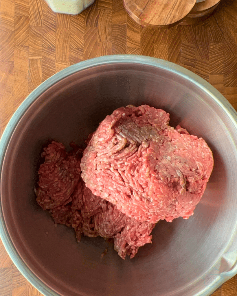 ground beef in a stainless steel bowl