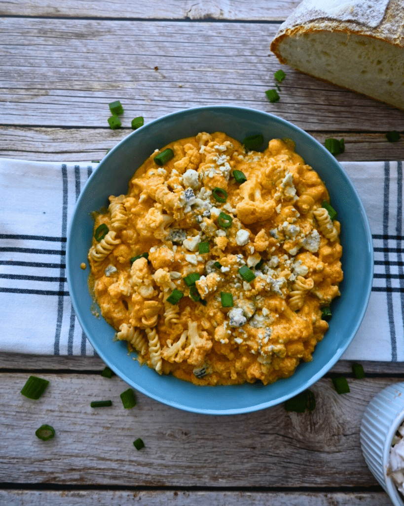 Slow cooker cauliflower buffalo macaroni and cheese in a bowl