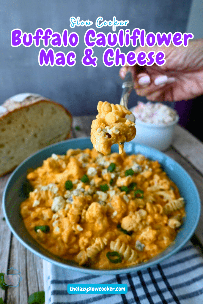 Slow cooker cauliflower buffalo macaroni and cheese on a fork over a bowl full of the same
