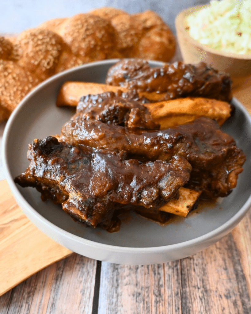 slow cooked beef back ribs in a grey bowl