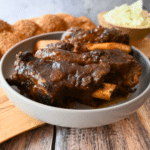 slow cooked beef back ribs in a grey bowl
