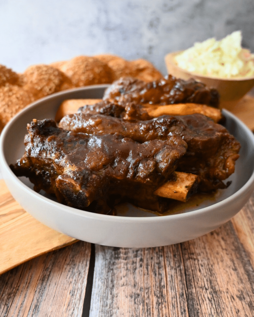 slow cooked beef back ribs in a grey bowl