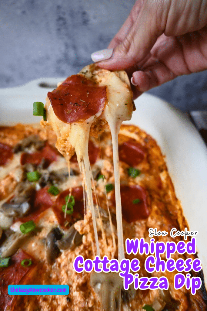 Gooey cheesy slow cooker cottage cheese pizza dip on a cracker
