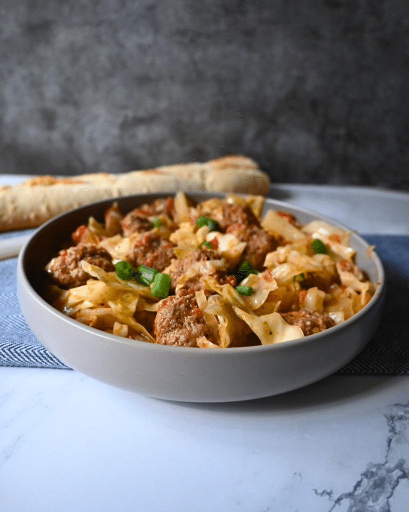 Meatballs and cabbage in a gray bowl