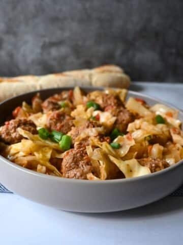 Meatballs and cabbage in a gray bowl