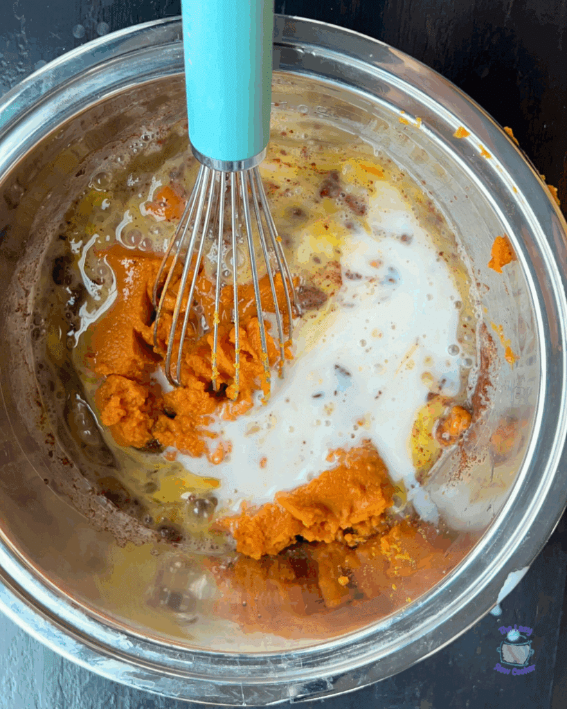 pumpkin egg custard mix in a mixing bowl with a whisk