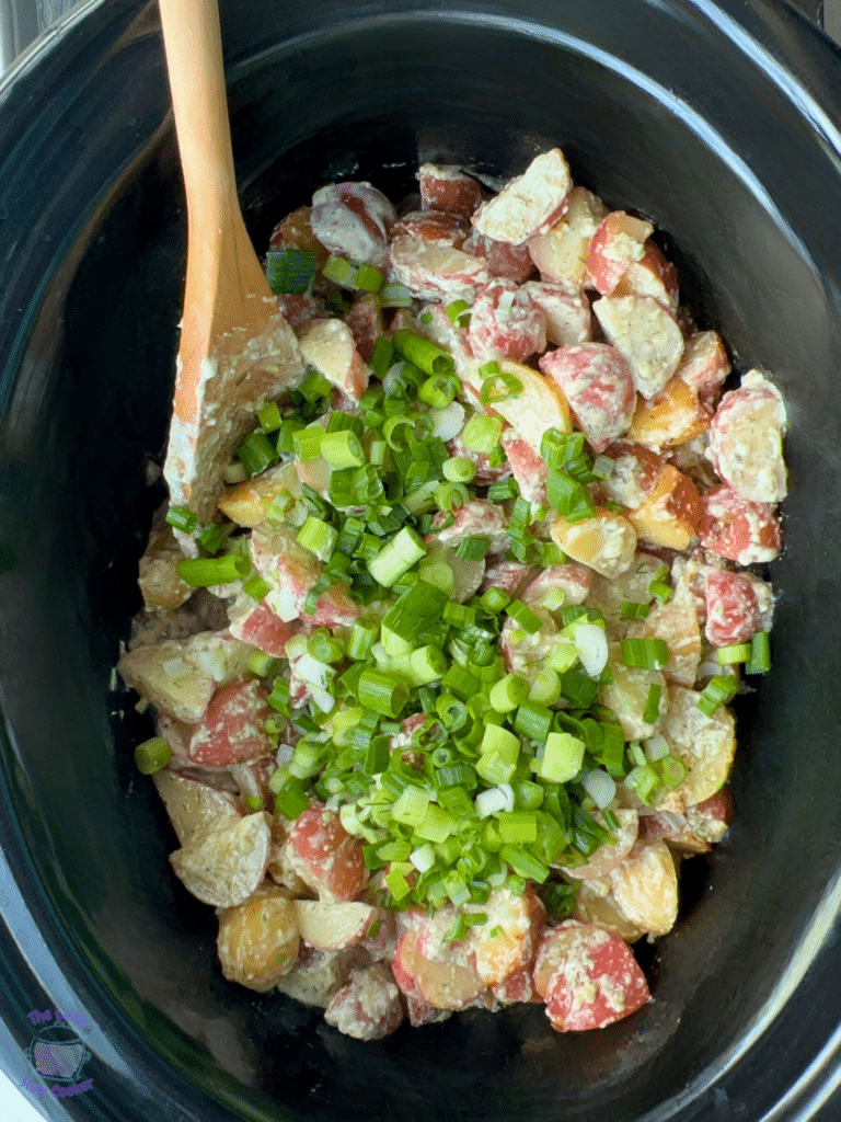 mix green onions and fresh dill into warm slow cooker potato salad just before serving