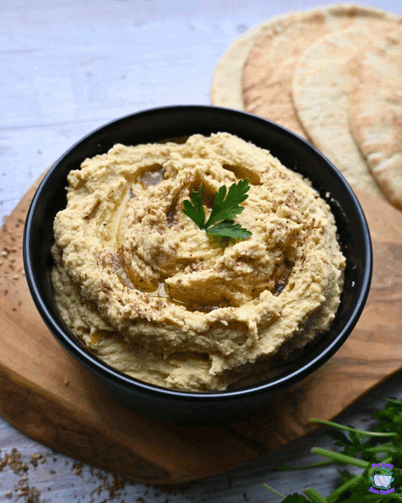 slow cooker hummus in a black bowl