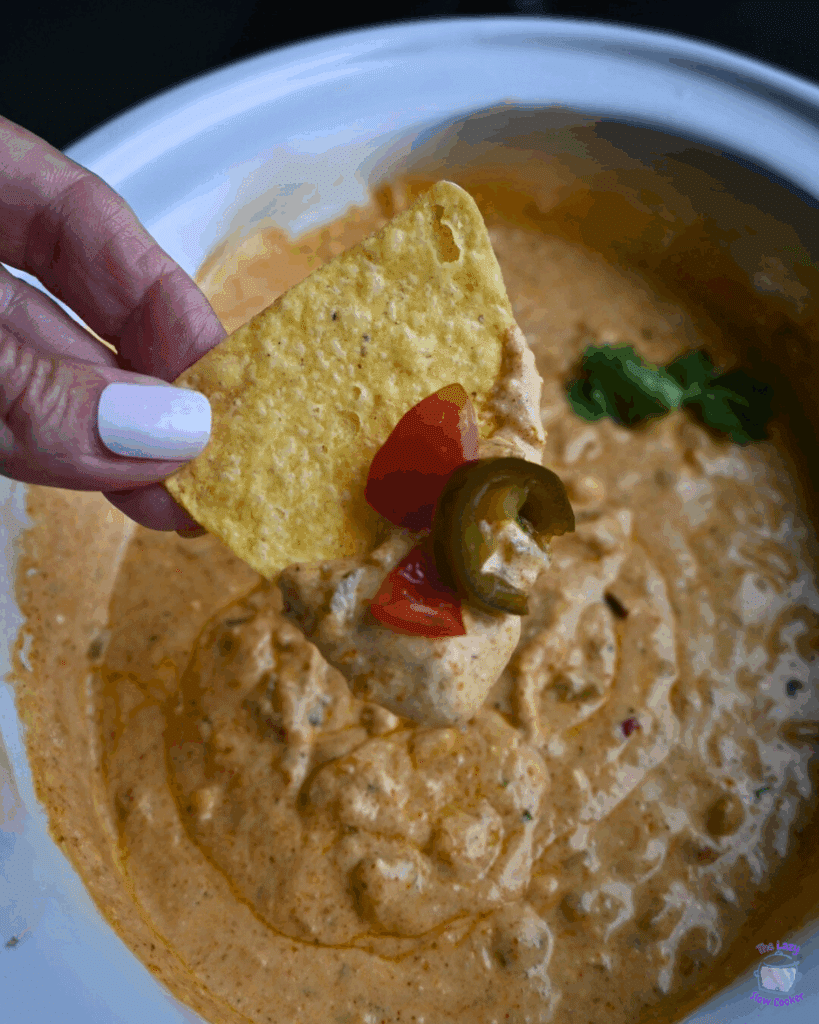 cottage cheese queso on a chip over a slow cooker full of the same
