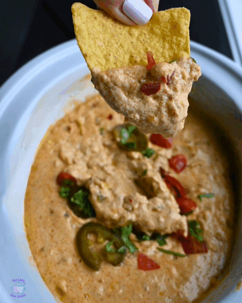 cottage cheese queso on a chip over a slow cooker full of the same