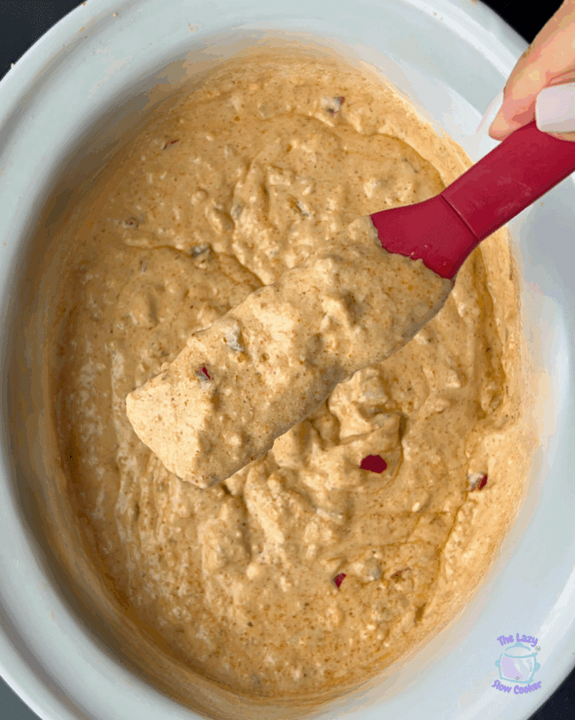 all queso ingredients in a crockpot stirred just after cooking