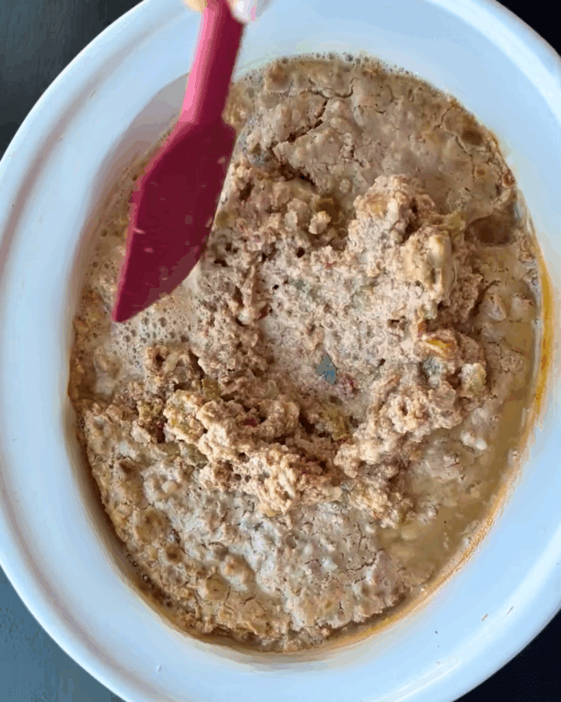 just finished cooking taco cottage cheese dip in a slow cooker being stirred