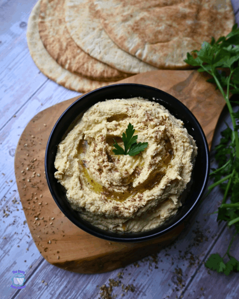 slow cooker hummus in a black bowl