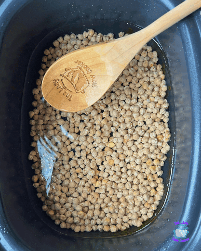 garbanzo beans in a crockpot before cooking