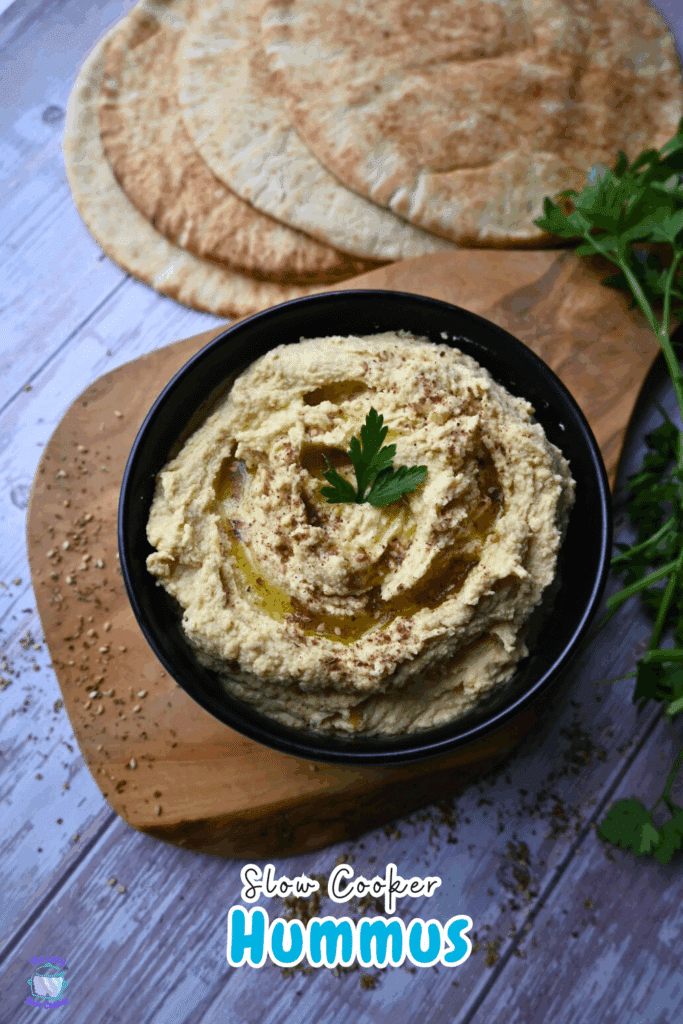 slow cooker hummus in a black bowl