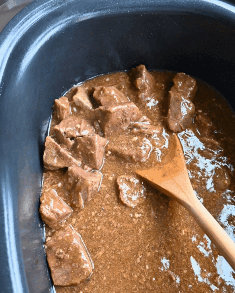 Steak bites in a slow cooker with gravy