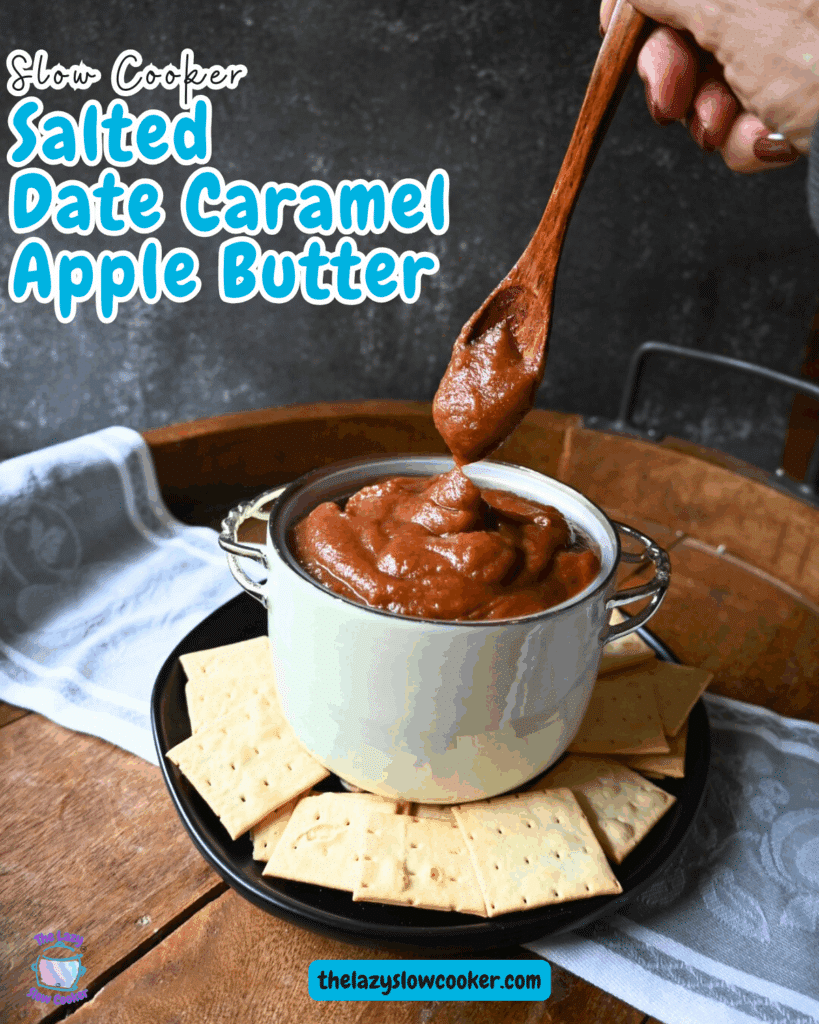 A thick, brown spread is being scooped with a wooden spoon from a white pot with metal handles, set on a wooden tray with a white cloth in the background.