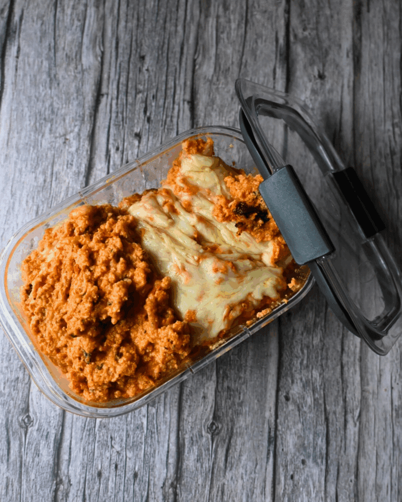 a storage container with leftover crockpot dip