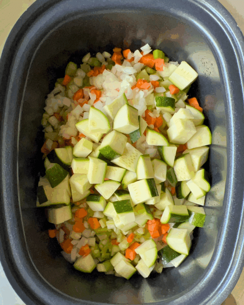 Vegetable and meatballs in a greased slow cooker