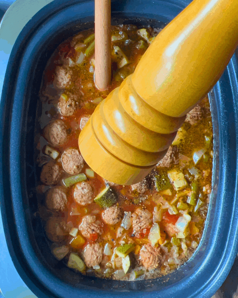 finished soup with a pepper grinder over top adding fresh pepper