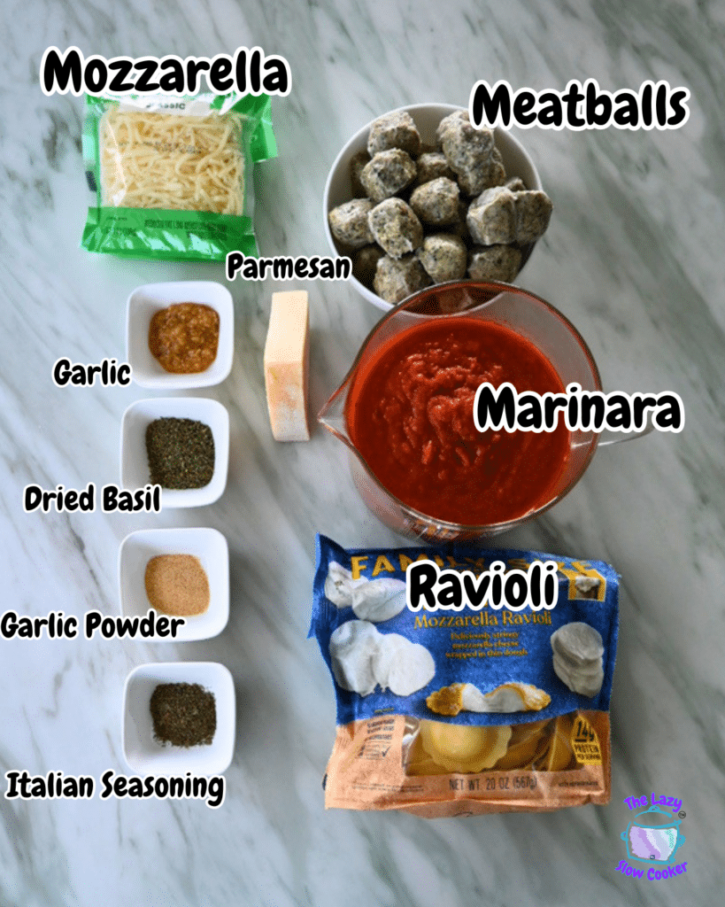 Overhead shot of labeled ingredients for slow cooker ravioli bake, including cheeses, meatballs, marinara sauce, spices, and ravioli.