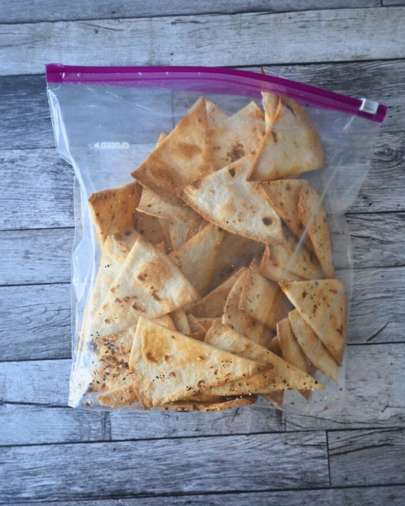 Homemade air fryer tortilla chips in a zip-lock bag
