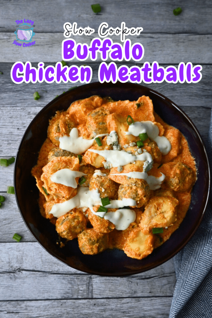 Buffalo chicken meatballs in orange sauce, topped with ranch and green onions, in a bowl on wood. Text: “Slow Cooker Buffalo Chicken Meatballs.”.