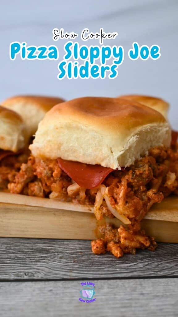 Three pizza sloppy joe sliders with meat, cheese, and pepperoni on buns rest on a wooden board. “Slow Cooker Pizza Sliders” appears above.