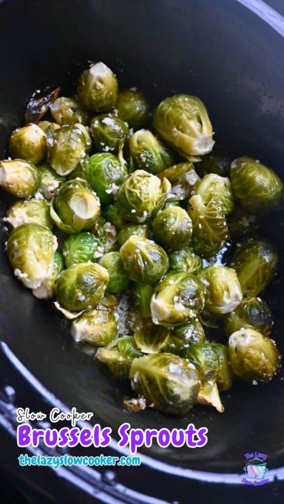 Brussels sprouts cook with garlic and seasoning in a slow cooker. Text on the image says “Slow Cooker Brussels Sprouts thelazyslowcooker.com.”.
