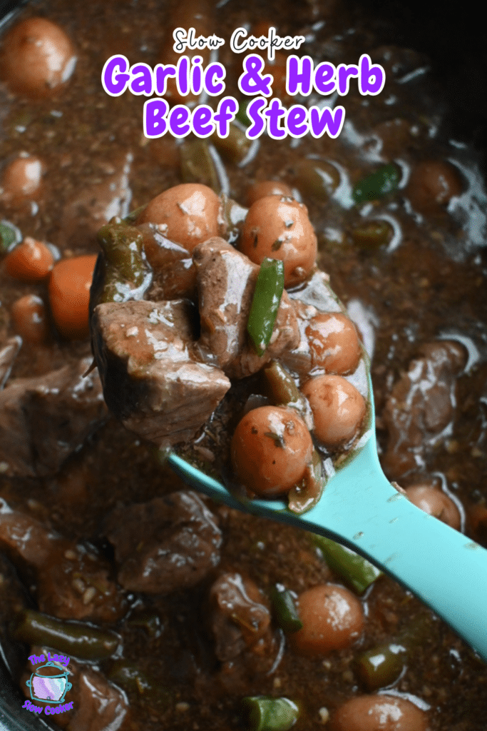A teal spoon lifts stew with beef, baby carrots, green beans, and potatoes in brown sauce. Text reads: "Slow Cooker Garlic & Herb Beef Stew.