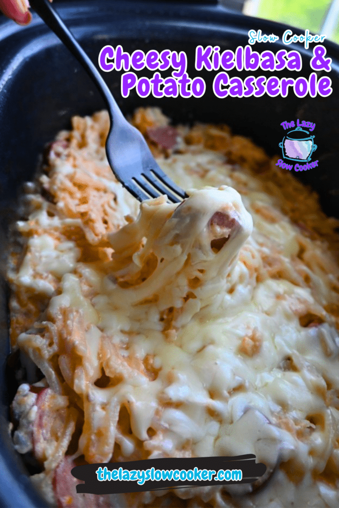 A fork lifts a cheesy portion of kielbasa and potatoes casserole from a slow cooker. Recipe title and website are shown on screen.