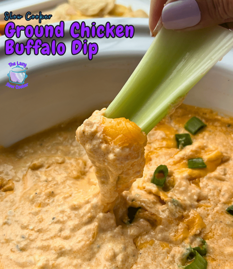 A hand dips a celery stick into a white bowl of creamy ground chicken buffalo dip, topped with melted cheese and sliced green onions. The recipe title appears above the bowl.