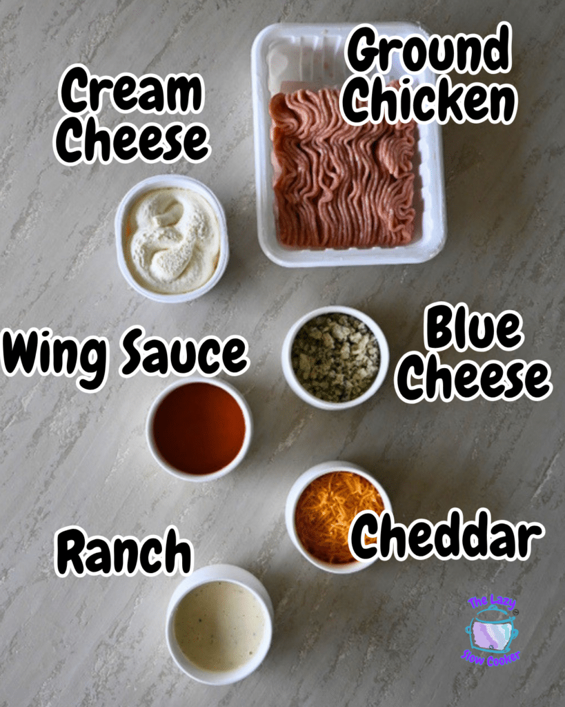 Six ingredients for ground chicken buffalo dip-ground chicken, cream cheese, shredded cheddar, crumbled blue cheese, ranch dressing, and wing sauce-are neatly arranged on a gray surface, each with a clear bold label for easy identification.